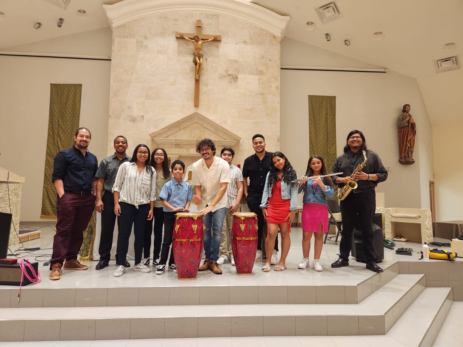IME musicians and students on the altar steps after a community concert