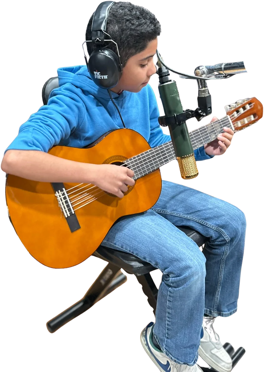 A Sound Birth student recording classical guitar