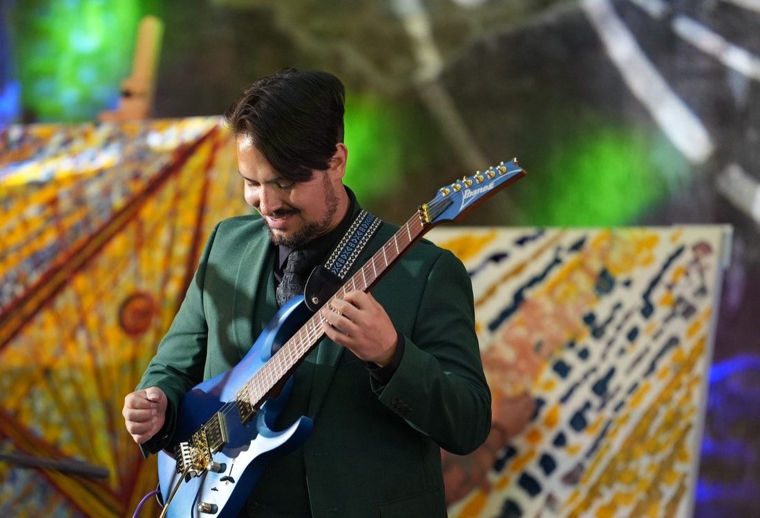 José Eduardo Muñoz performing on electric guitar